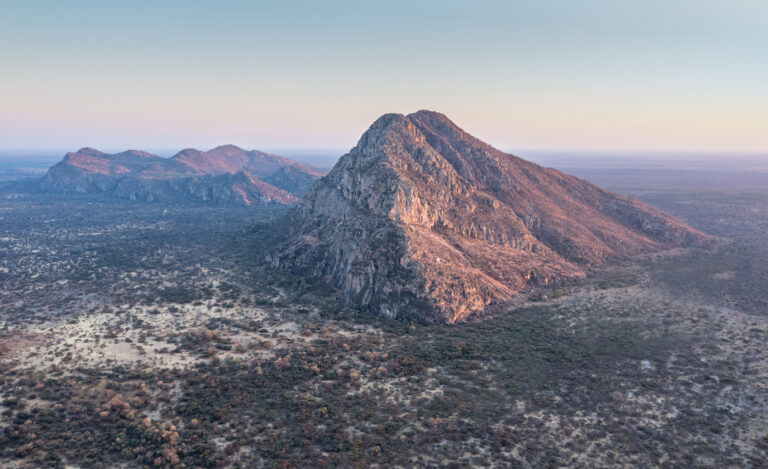 The sacred Tsodilo HIlls rise from the kalahari sands just 40 kms from Nxamaseri Island Lodge