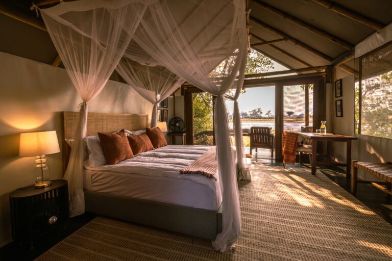 Okavango Horse Safari spacious tents with double bed and mosquito net, looking on to views on to the waters of the Okavango.