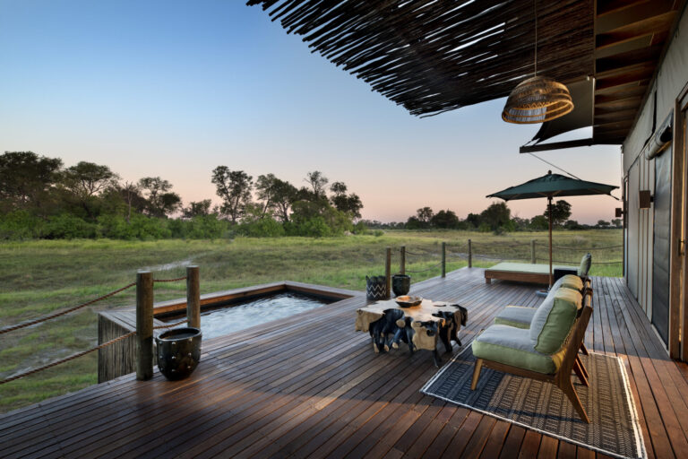 Private deck with plunge pool overlooking the Okavango Delta at Atzaró Okavango Camp in Botswana.
