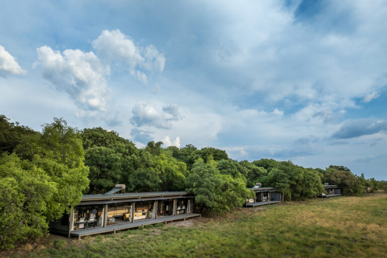 Spacious guest rooms at King Lewanika Lodge set within the natural landscape of Liuwa Plain