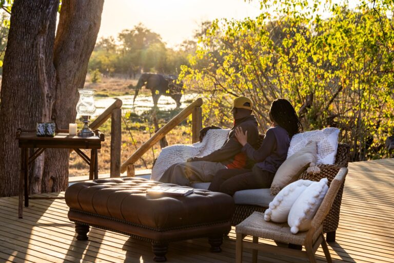 View from MmaTsebe´s main deck looking elephant drinking from the Mbudi River in Khwai