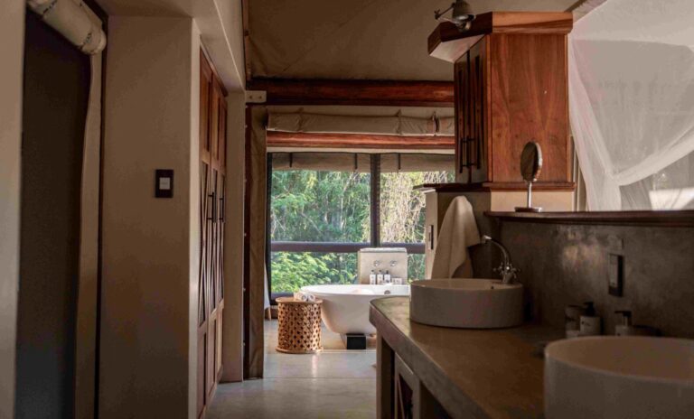 Large ensuite bathroom with free-standing bath with views on to the surroundings from your luxury tent in Tuli Safari Lodge Mashatu